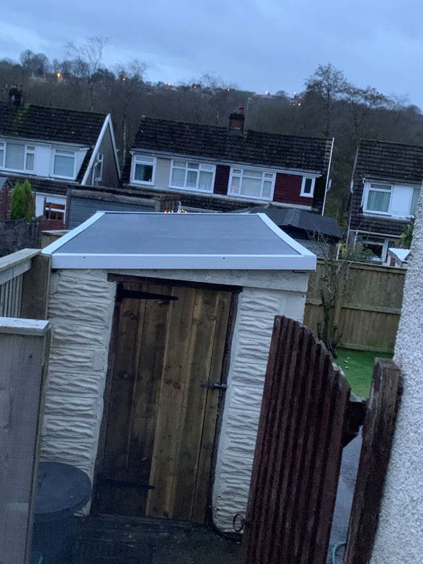 Garden shed before its new roof