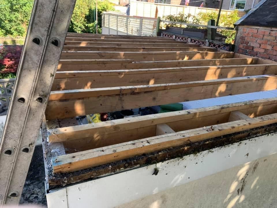 Flat roof stripped back to the joists