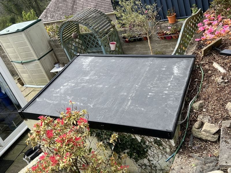 Garden outbuilding with a new rubber roof
