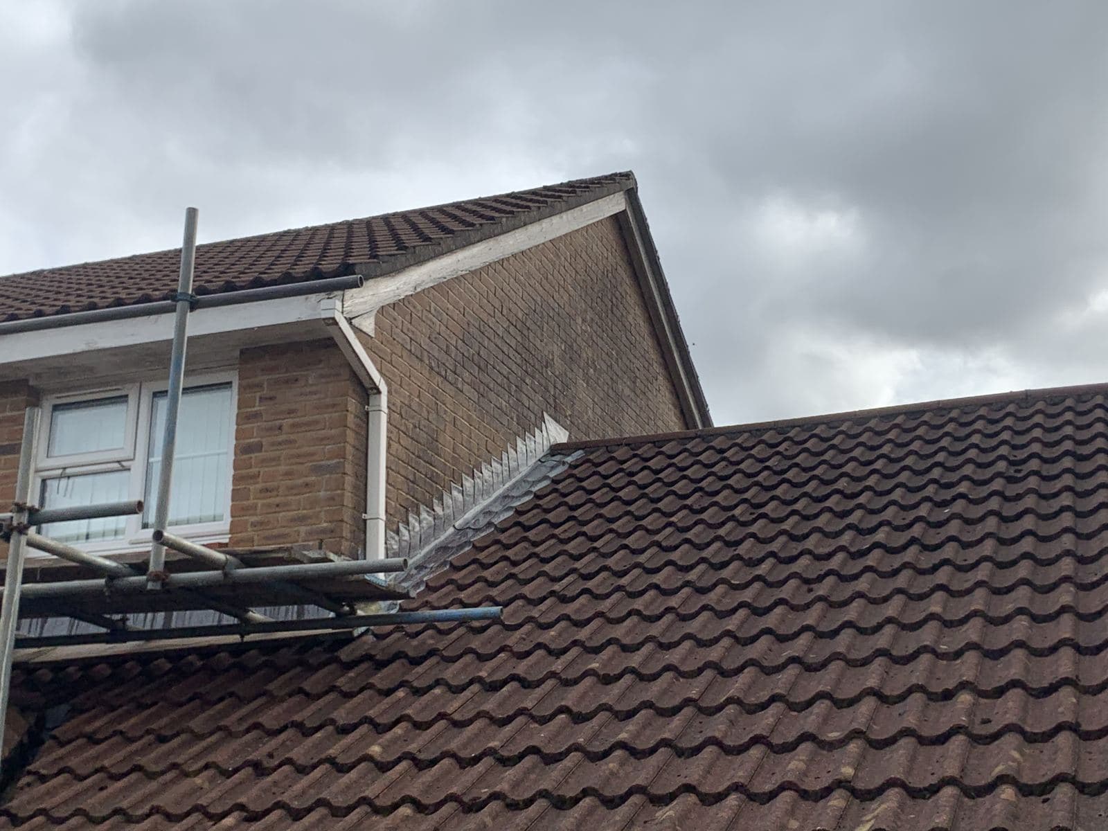 New white fascias and gutters on a house and garage