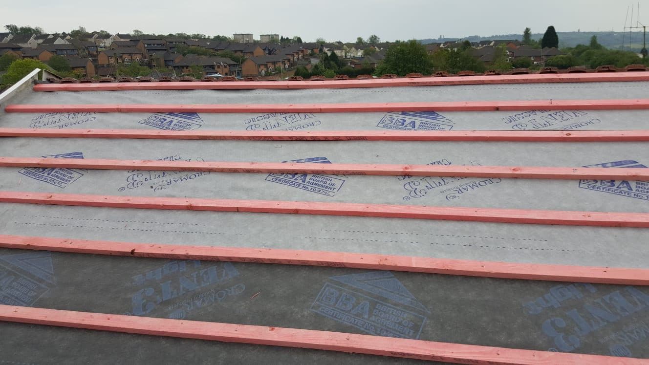 New membrane and battens on a roof being re-tiled