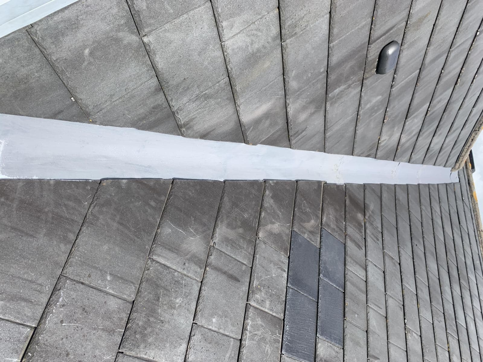 A lead valley between two roof slopes